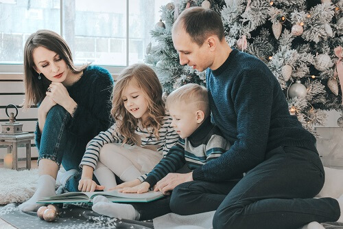 Family reading a book